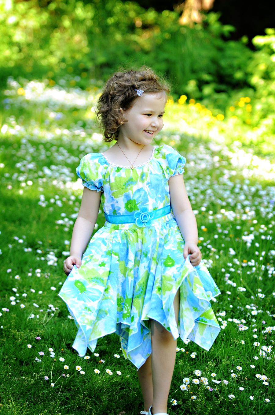 A beautiful blue and green flower dress was a perfect fit for our photo shoot in the daisies at Stanley Park in Vancouver.