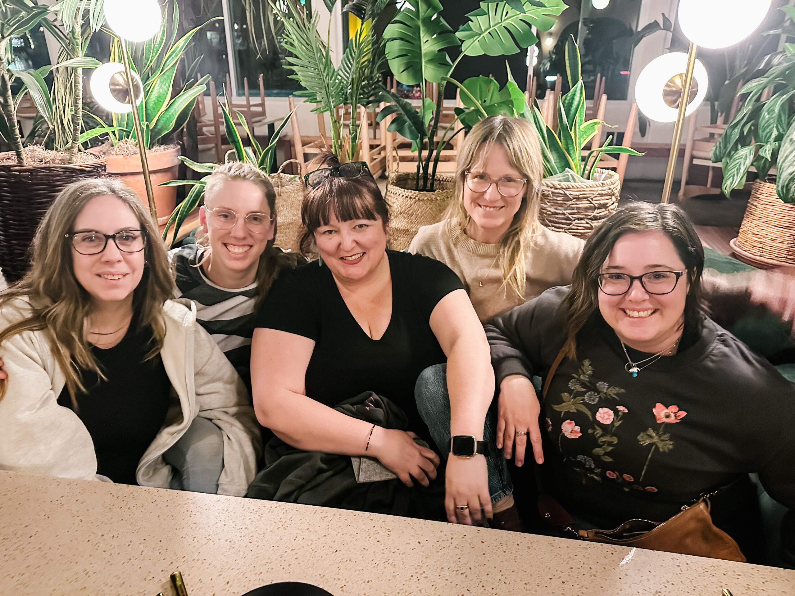 Five ladies sit together in a restaurant in Palm Springs